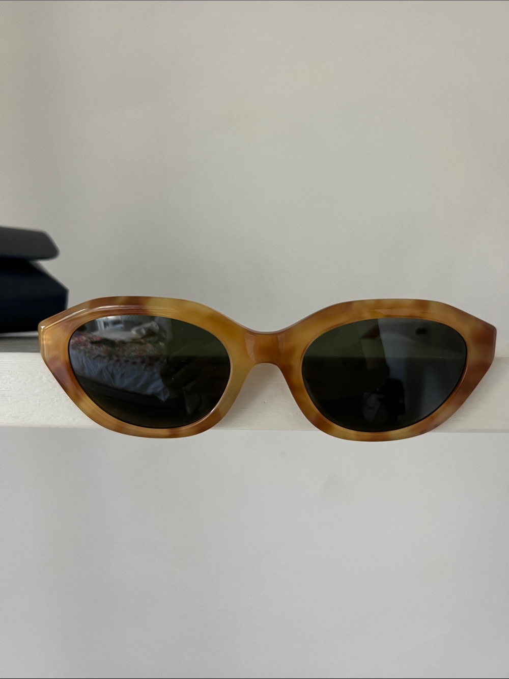 Polo by Ralph Lauren Tortoiseshell Oval Sunglasses with Dark Lenses